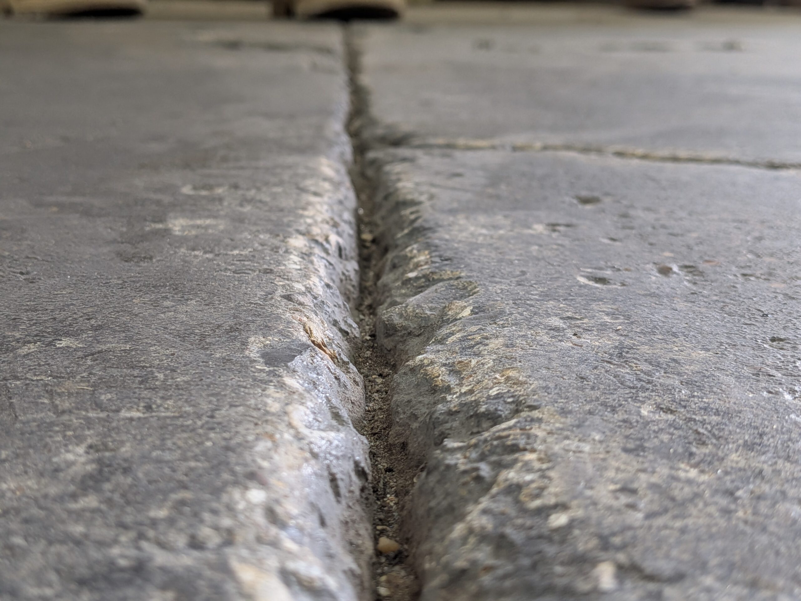 PXL_20250605_162852961 Photo demonstrating the depth of a concrete floor crack before being repaired with FasTrac Crackweld Pro.